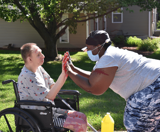 Mary Thurmond high-fives an Individual