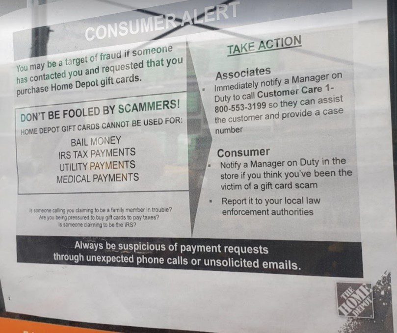 Image of a sign at Home Depot that reads: "Consumer Alert: You may be a target of fraud if someone has contacted you and requested that you purchase Home Depot gift cards. Don't be fooled by scammers!" and information on how to take action.